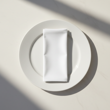 Load image into Gallery viewer, White velvet napkin arranged on a plain white plate
